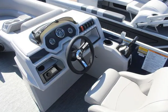 Slide: The Image of 2025 Godfrey Pontoons Xperience 1680 CX helm with modern controls and comfortable seating. - 6
