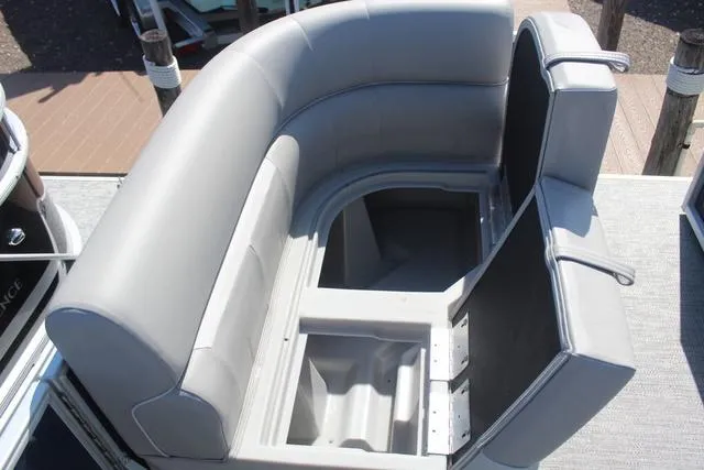 Slide: The Image of 2025 Godfrey Pontoons Xperience 1680 CX seating with storage compartments open. - 8