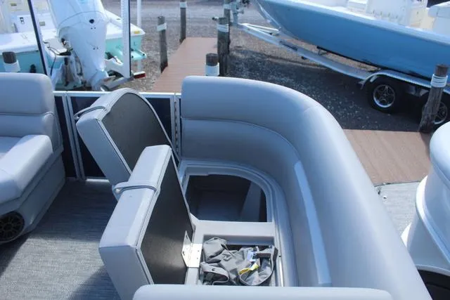 Slide: The Image of 2025 Godfrey Pontoons Xperience 1680 CX interior seating with storage compartment. - 9