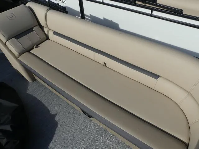 Slide: The Image of 2025 Godfrey Pontoons Sweetwater 2486 C interior seating with beige upholstery. - 9