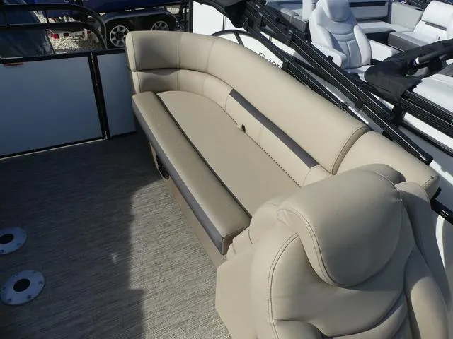 Slide: The Image of 2025 Godfrey Pontoons Sweetwater 2286 SB interior seating, beige upholstery, spacious layout. - 13