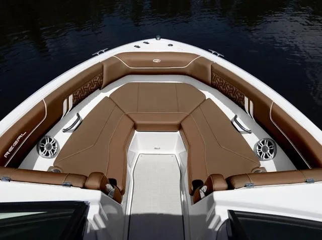 Slide: The Image of 2025 Regal LS2 boat interior with brown leather seating and sleek design. - 3