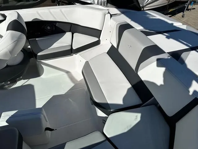 Slide: The Image of Luxurious seating in 2025 Regal 2000 ES boat, featuring sleek white and gray upholstery. - 7