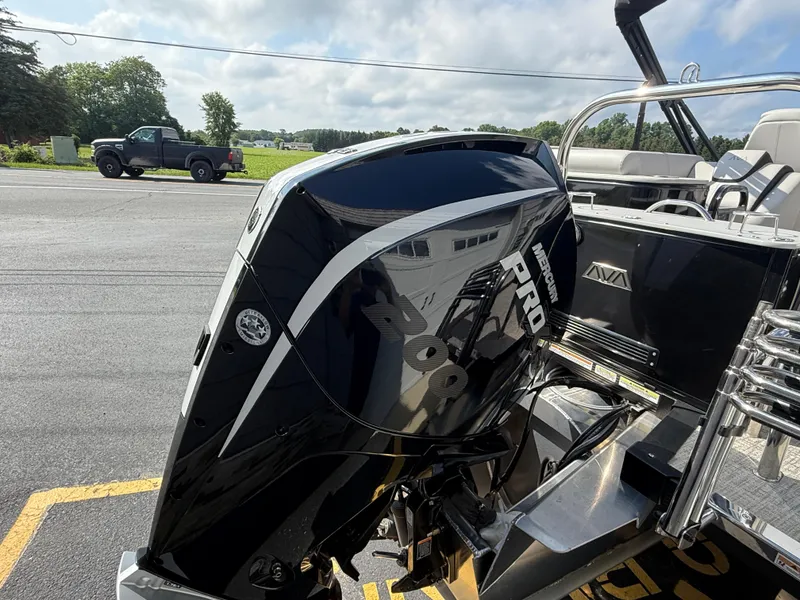 Slide: The Image of 2025 Avalon 2385 Catalina Quad Lounger with high-performance tri-toon engine, parked outdoors. - 11