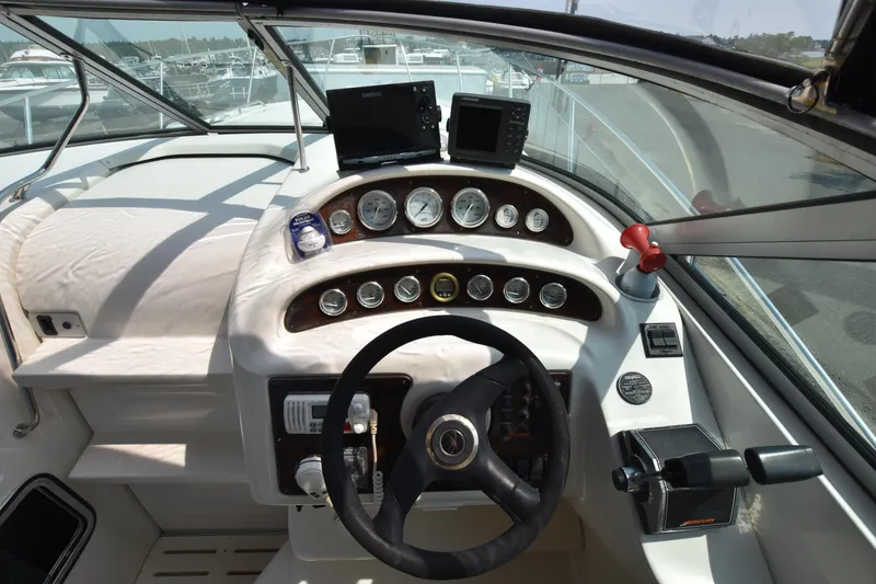 Slide: The Image of Cockpit of 2000 Monterey 302 Cruiser with steering wheel and instrument panel. - 11