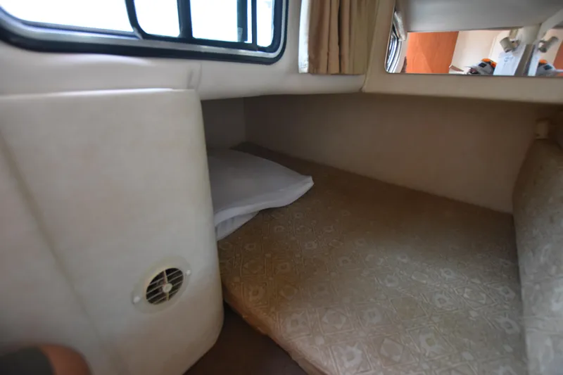 Slide: The Image of Interior cabin of 2000 Monterey 302 Cruiser with bed and window. - 21