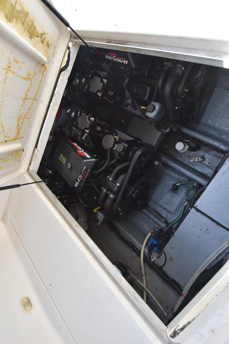 Slide: The Image of Engine compartment of 2000 Monterey 302 Cruiser boat, showcasing dual MerCruiser engines. - 24