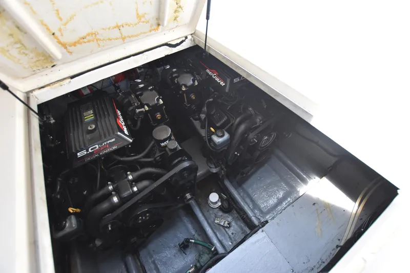 Slide: The Image of Engine compartment of a 2000 Monterey 302 Cruiser boat, showcasing dual engines. - 25