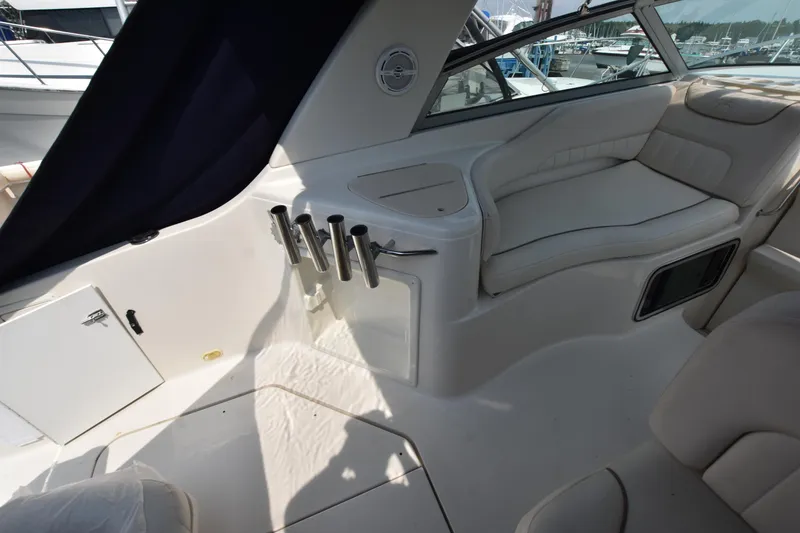 Slide: The Image of Interior of 2000 Monterey 302 Cruiser boat with seating and rod holders. - 8