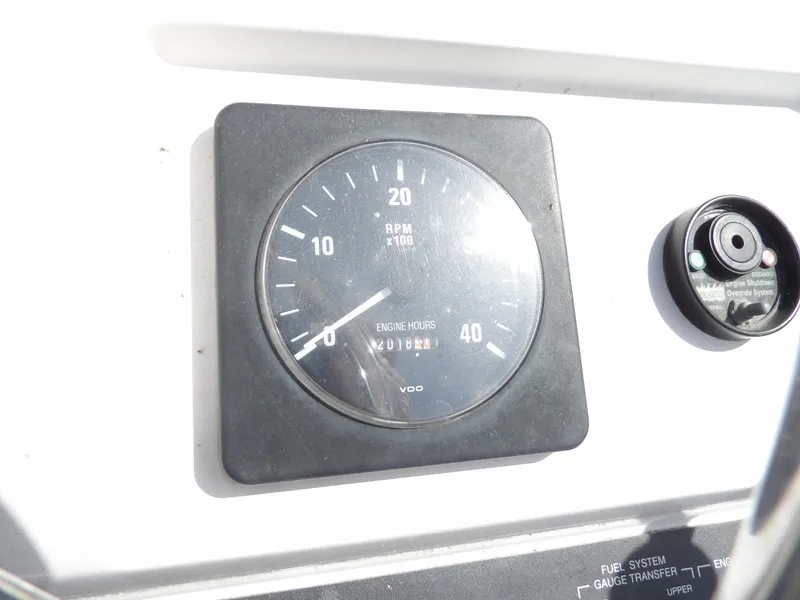 Slide: The Image of 1999 Mainship 350 Trawler RPM gauge and control panel. - 19