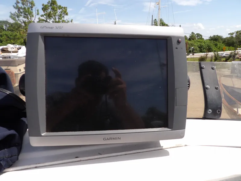 Slide: The Image of Garmin GPS device on 1999 Mainship 350 Trawler, outdoor setting. - 21