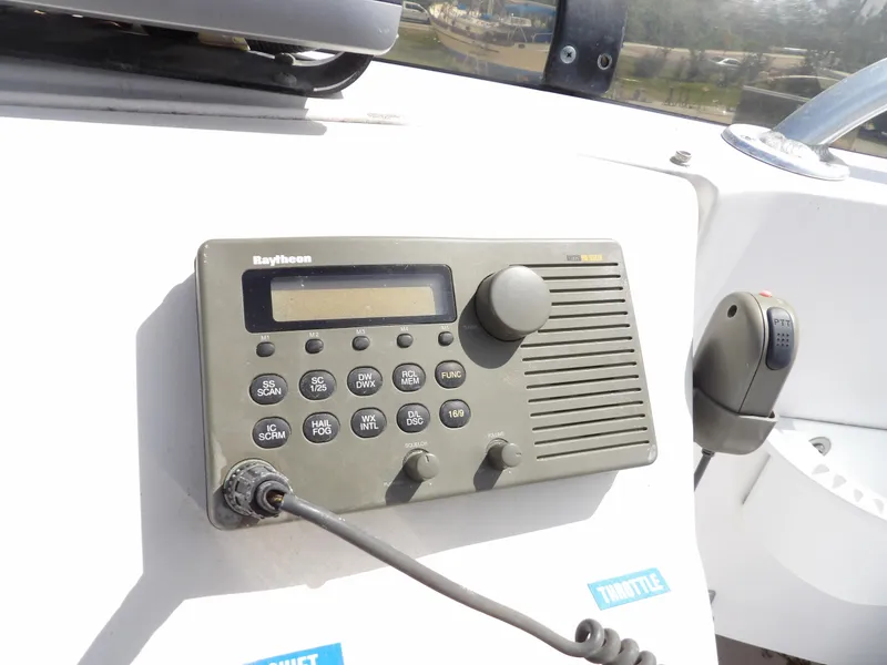 Slide: The Image of Raytheon marine radio on 1999 Mainship 350 Trawler dashboard. - 23