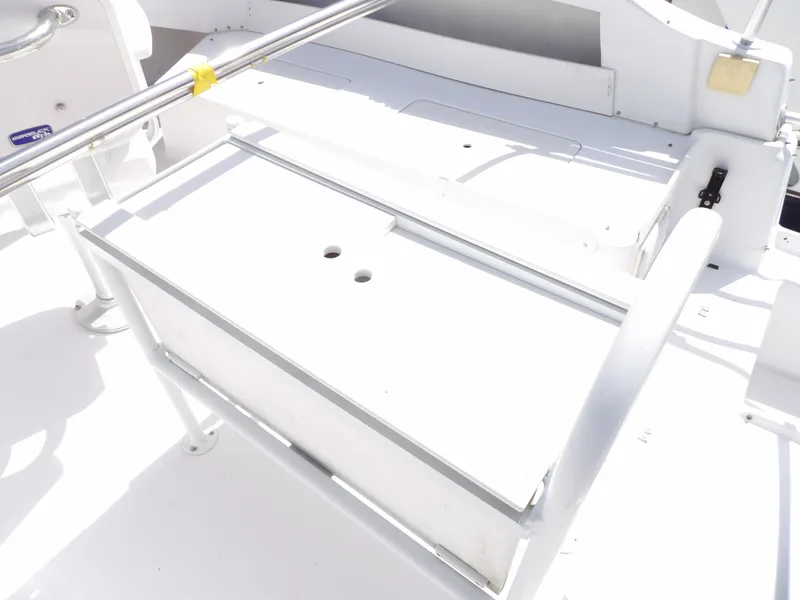 Slide: The Image of 1999 Mainship 350 Trawler deck detail with white seating and railing. - 25