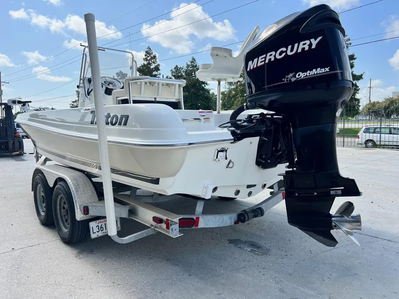 Slide: The Image of 2009 Triton 220 LTS boat with Mercury OptiMax engine on trailer. - 11