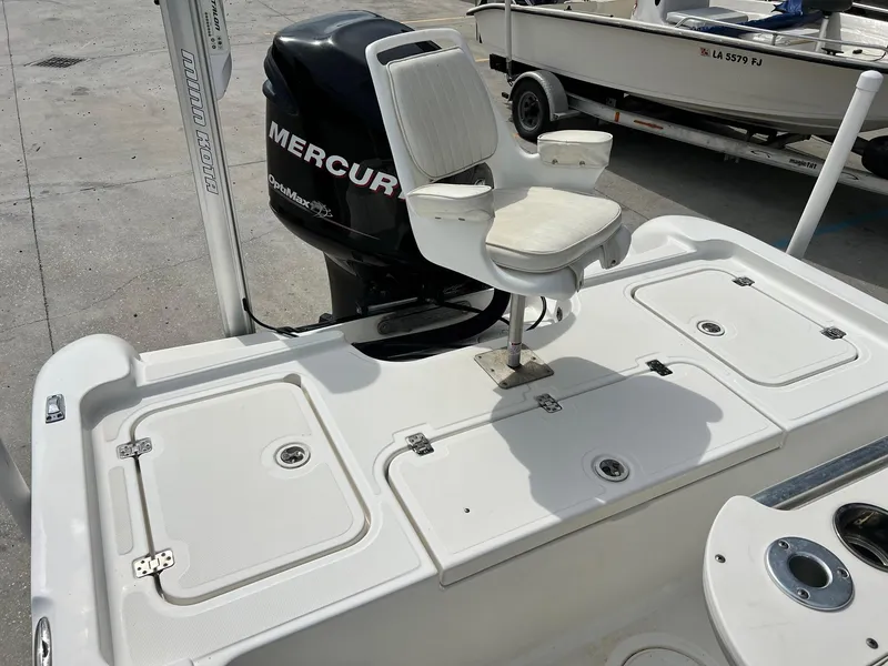 Slide: The Image of 2009 Triton 220 LTS boat with Mercury OptiMax engine and fishing seat. - 12