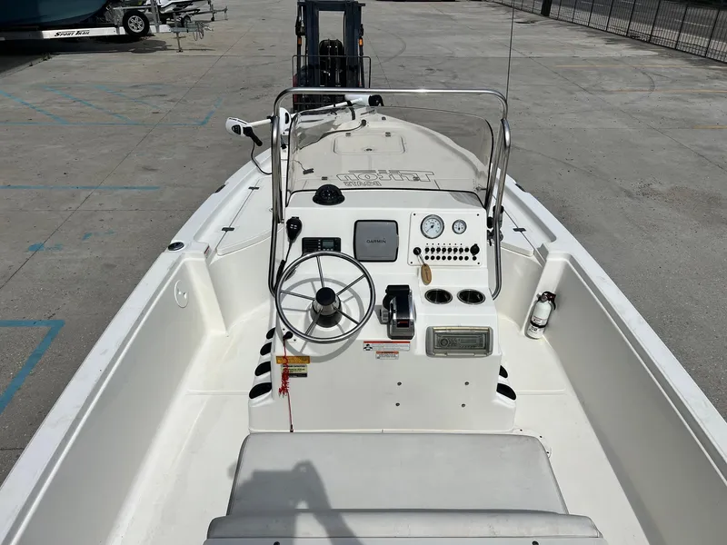 Slide: The Image of 2009 Triton 220 LTS boat interior with steering wheel and control panel. - 4