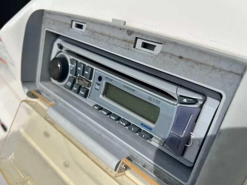 Slide: The Image of Marine stereo system on a 2009 Triton 220 LTS boat dashboard. - 7