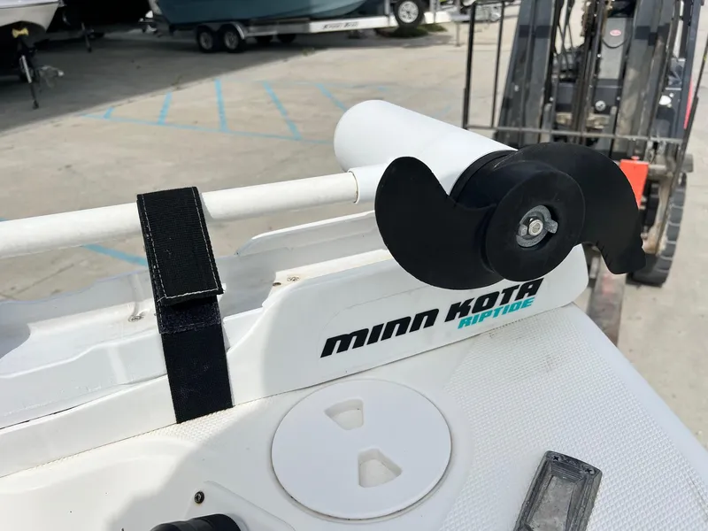 Slide: The Image of Minn Kota Riptide motor on 2009 Triton 220 LTS boat, docked in marina. - 8