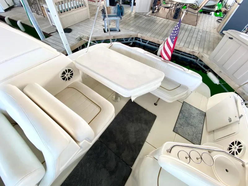 Slide: The Image of 2001 Sea Ray 290 Sundancer boat interior with seating and table. - 20