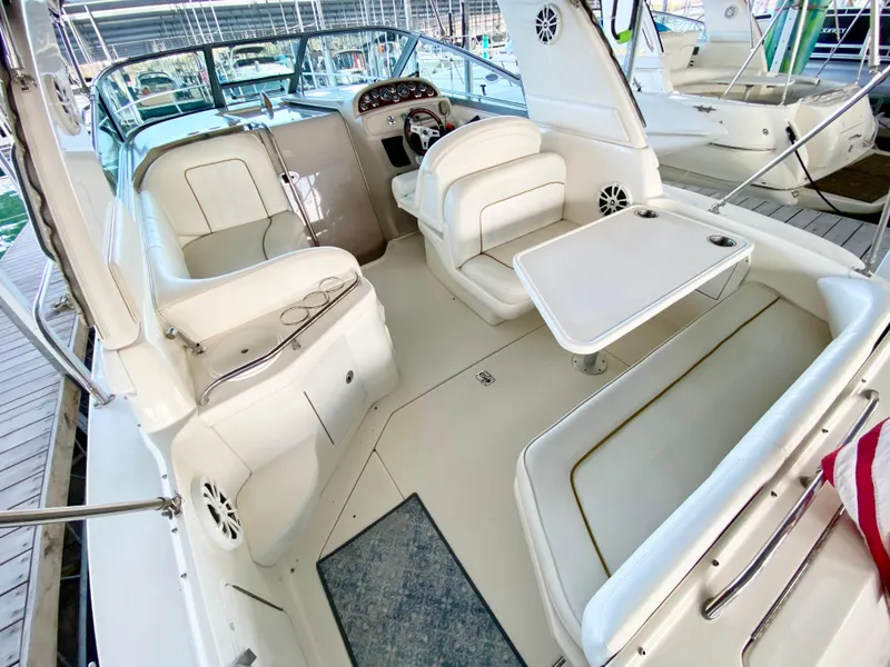 Slide: The Image of 2001 Sea Ray 290 Sundancer boat interior with seating and table. - 6