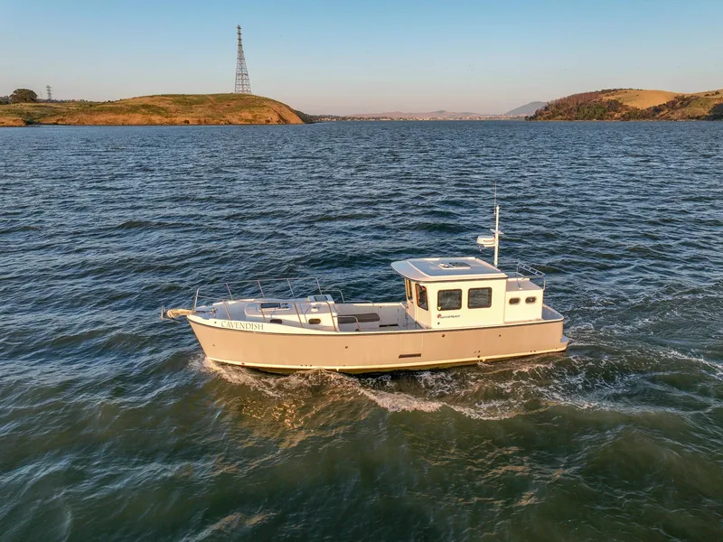 The Image of 2024 SeaPiper 37 boat cruising on a scenic waterway. - 0