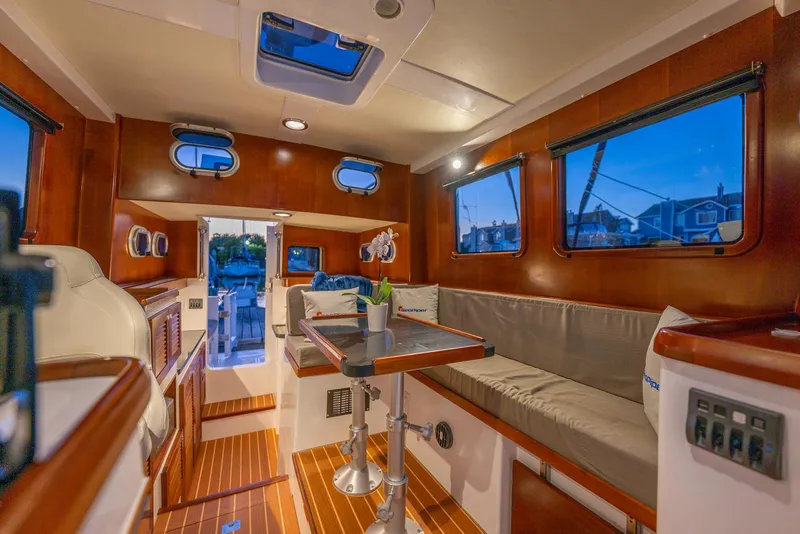 Slide: The Image of Luxurious interior of 2024 SeaPiper 37 yacht with elegant wood finish and cozy seating. - 10
