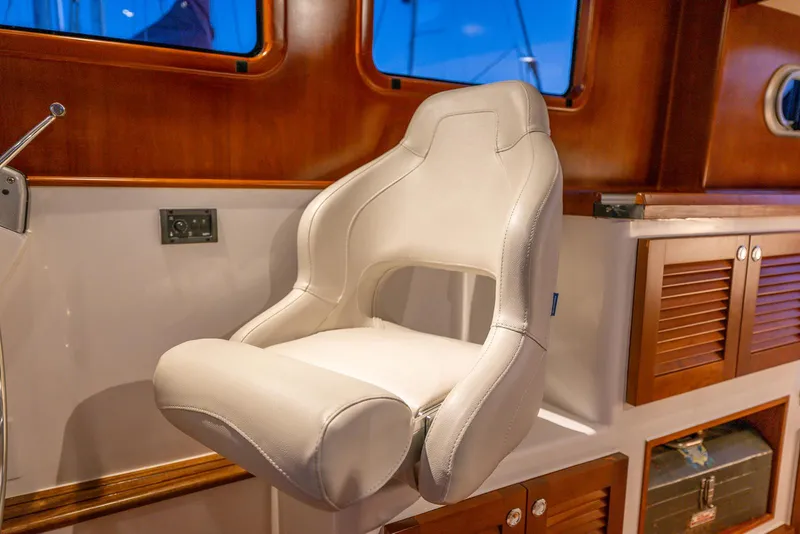 Slide: The Image of Luxurious white captain's chair in 2024 SeaPiper 37 boat interior. - 11