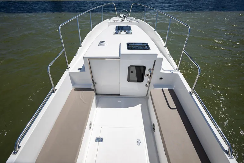 Slide: The Image of 2024 SeaPiper 37 boat deck with railing and cabin door. - 13
