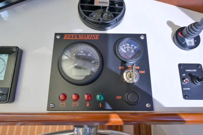 Slide: The Image of Control panel of 2024 SeaPiper 37 boat featuring Beta Marine gauges and switches. - 19