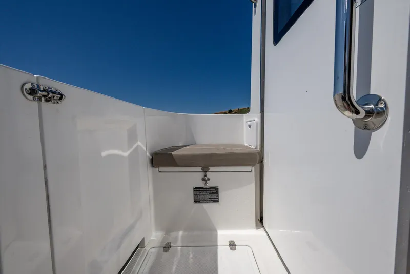 Slide: The Image of SeaPiper 37 boat deck with seating, 2024 model, under clear blue sky. - 3