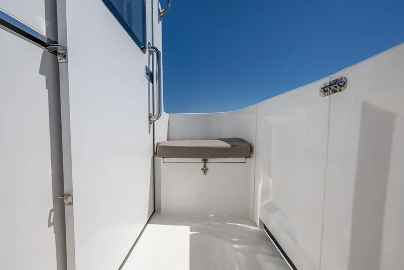 Slide: The Image of 2024 SeaPiper 37 boat deck with seating, clear blue sky background. - 4