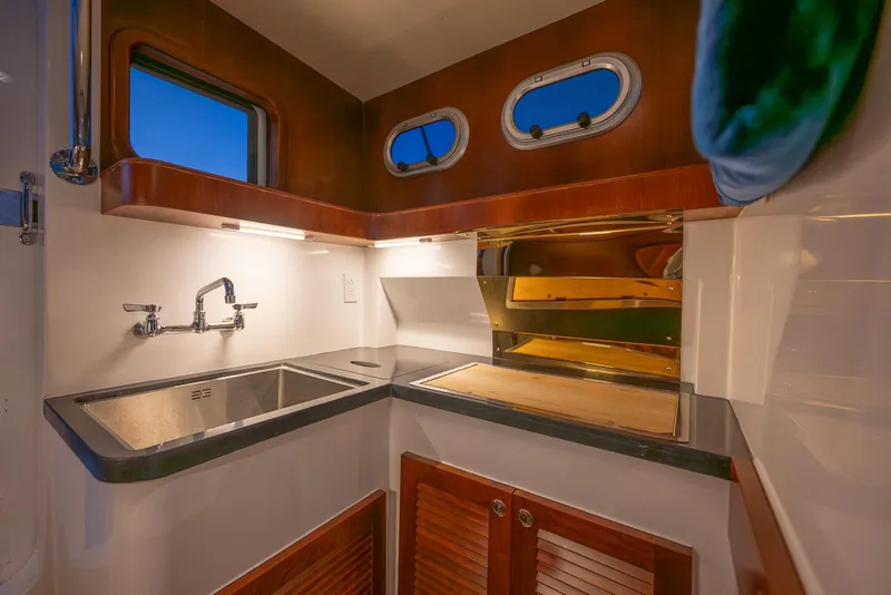 Slide: The Image of Modern kitchen area in 2024 SeaPiper 37 boat with sink and storage. - 5