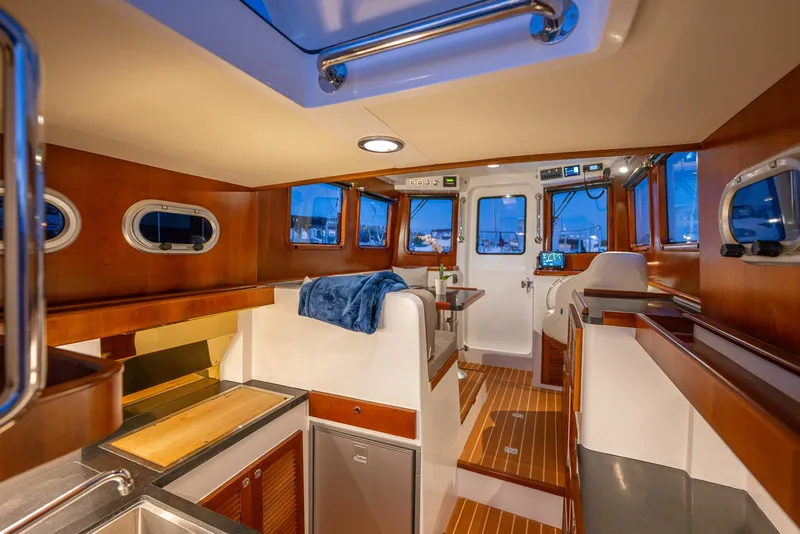Slide: The Image of Luxurious interior of 2024 SeaPiper 37 yacht with wood finishes and modern amenities. - 7