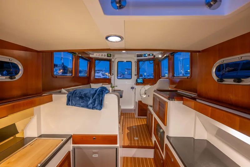 Slide: The Image of Interior of 2024 SeaPiper 37 boat with wood finishes and modern amenities. - 8