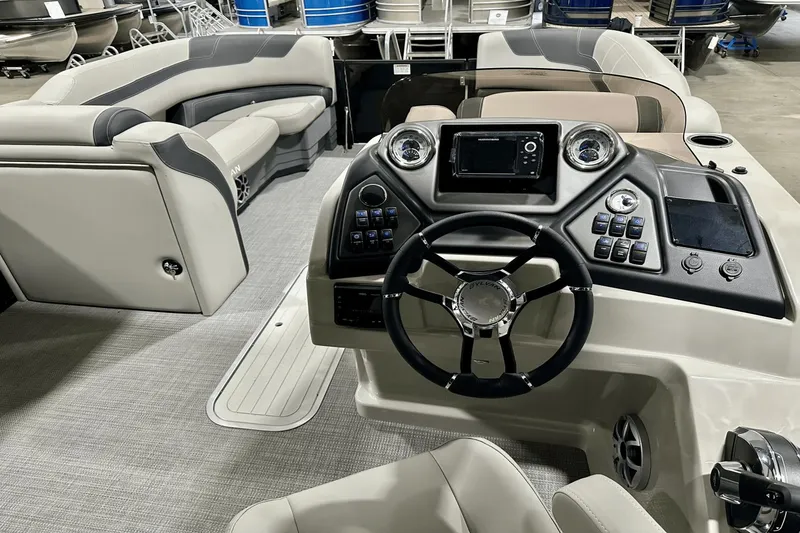 Slide: The Image of 2025 Sylvan L-5 boat interior with modern dashboard and seating. - 16