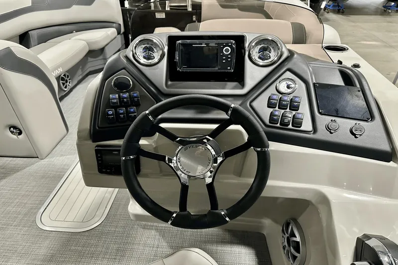 Slide: The Image of Steering console of 2025 Sylvan L-5 boat with modern controls and dashboard. - 17