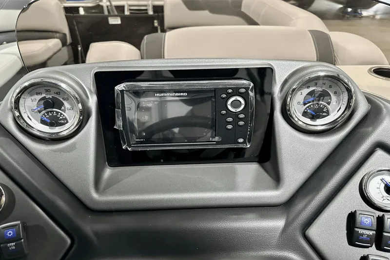 Slide: The Image of Dashboard of 2025 Sylvan L-5 boat with Humminbird Helix 5 GPS and gauges. - 18