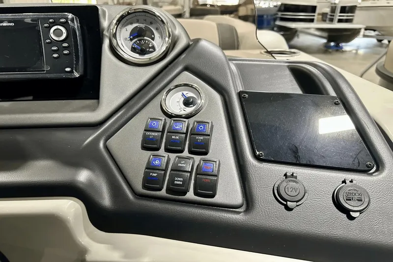 Slide: The Image of Control panel of 2025 Sylvan L-5 boat with switches and gauges. - 20