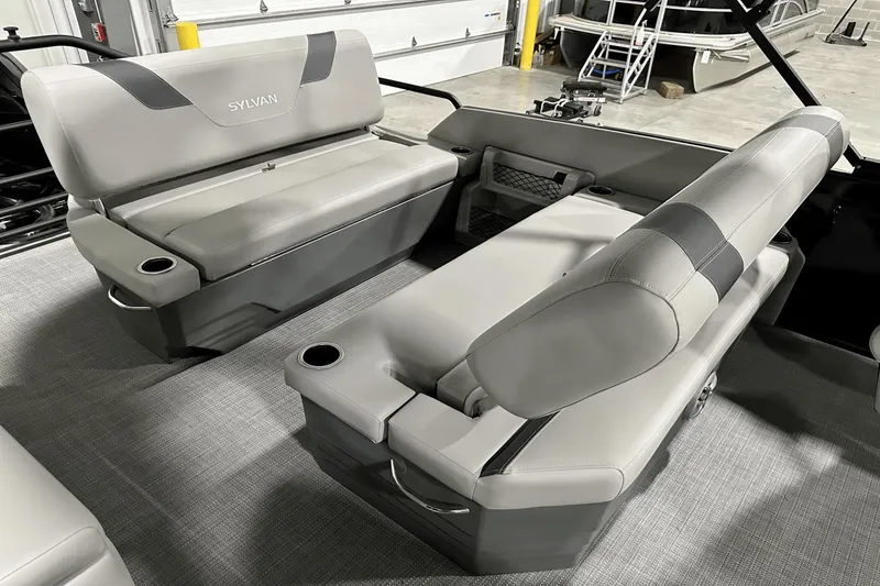 Slide: The Image of Interior seating of 2025 Sylvan L-5 boat with gray upholstery and cup holders. - 26
