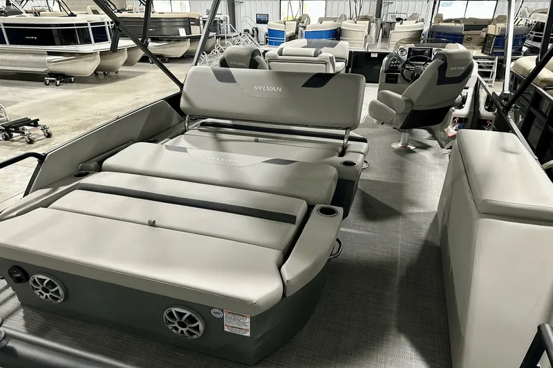 Slide: The Image of 2025 Sylvan L-5 pontoon boat interior with plush seating and modern design. - 31