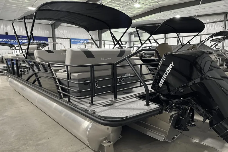 Slide: The Image of 2025 Sylvan L-5 pontoon boat with Mercury engine in showroom. - 7