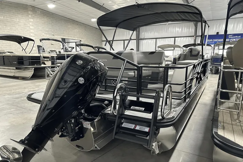 Slide: The Image of 2025 Sylvan L-5 pontoon boat with outboard motor in showroom. - 8