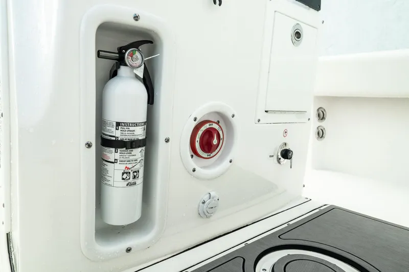 Slide: The Image of 2023 Edgewater 188CC boat interior with fire extinguisher and control panel. - 10