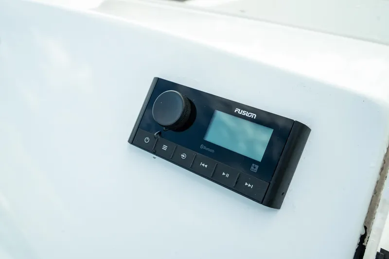 Slide: The Image of Fusion marine stereo on 2023 Edgewater 188CC boat dashboard. - 12