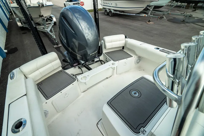 Slide: The Image of 2023 Edgewater 188CC boat interior with Yamaha outboard motor, spacious seating, and storage compartments. - 14