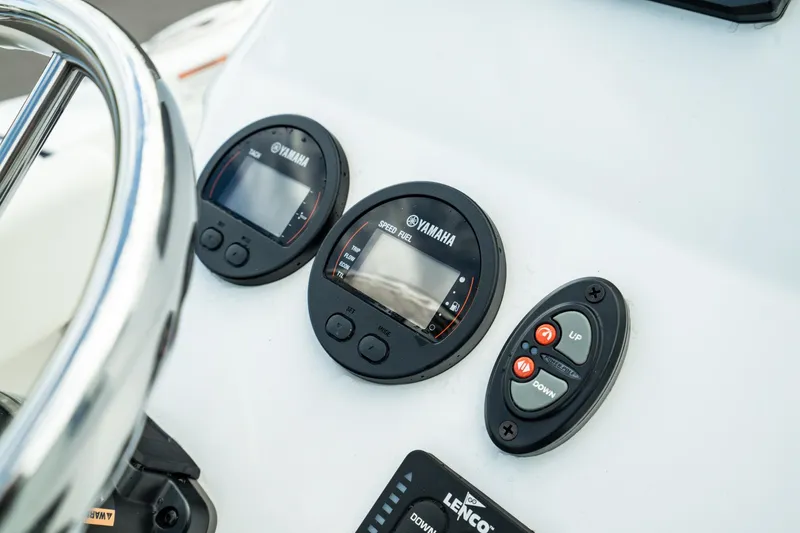 Slide: The Image of 2023 Edgewater 188CC boat dashboard with Yamaha gauges and controls. - 19