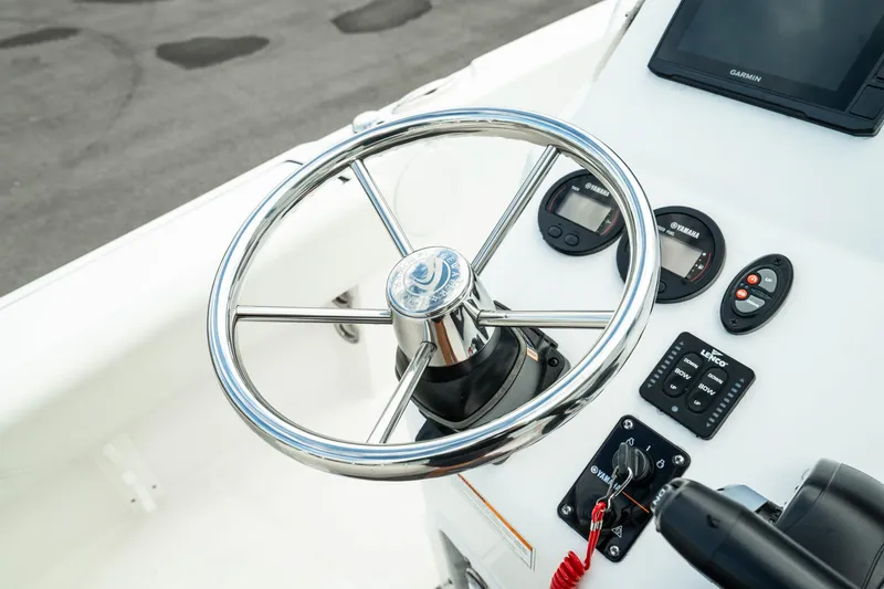 Slide: The Image of Edgewater 188CC 2023 boat steering wheel and dashboard controls. - 22