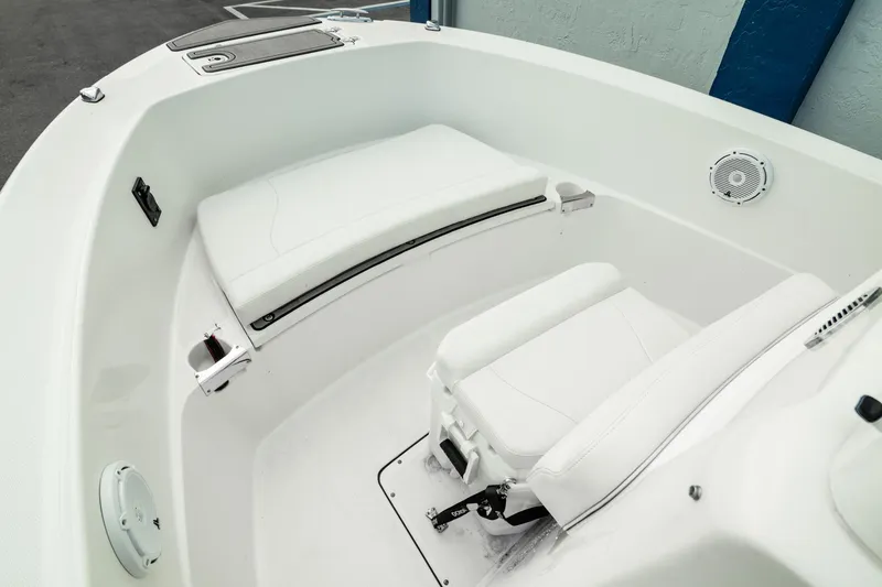 Slide: The Image of 2023 Edgewater 188CC boat interior with white seating and storage compartments. - 3