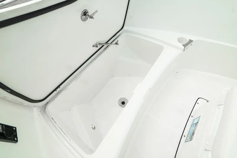 Slide: The Image of 2023 Edgewater 188CC boat storage compartment, open and empty. - 30