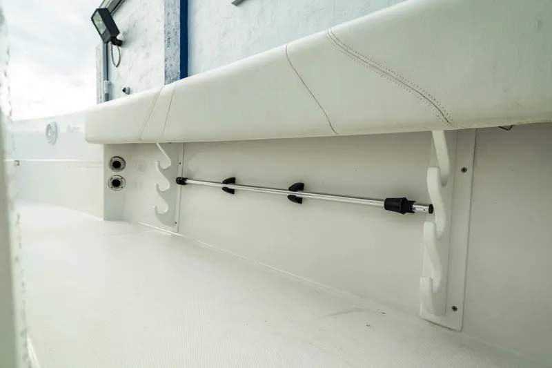 Slide: The Image of 2023 Edgewater 188CC boat interior with rod holder and seating detail. - 38